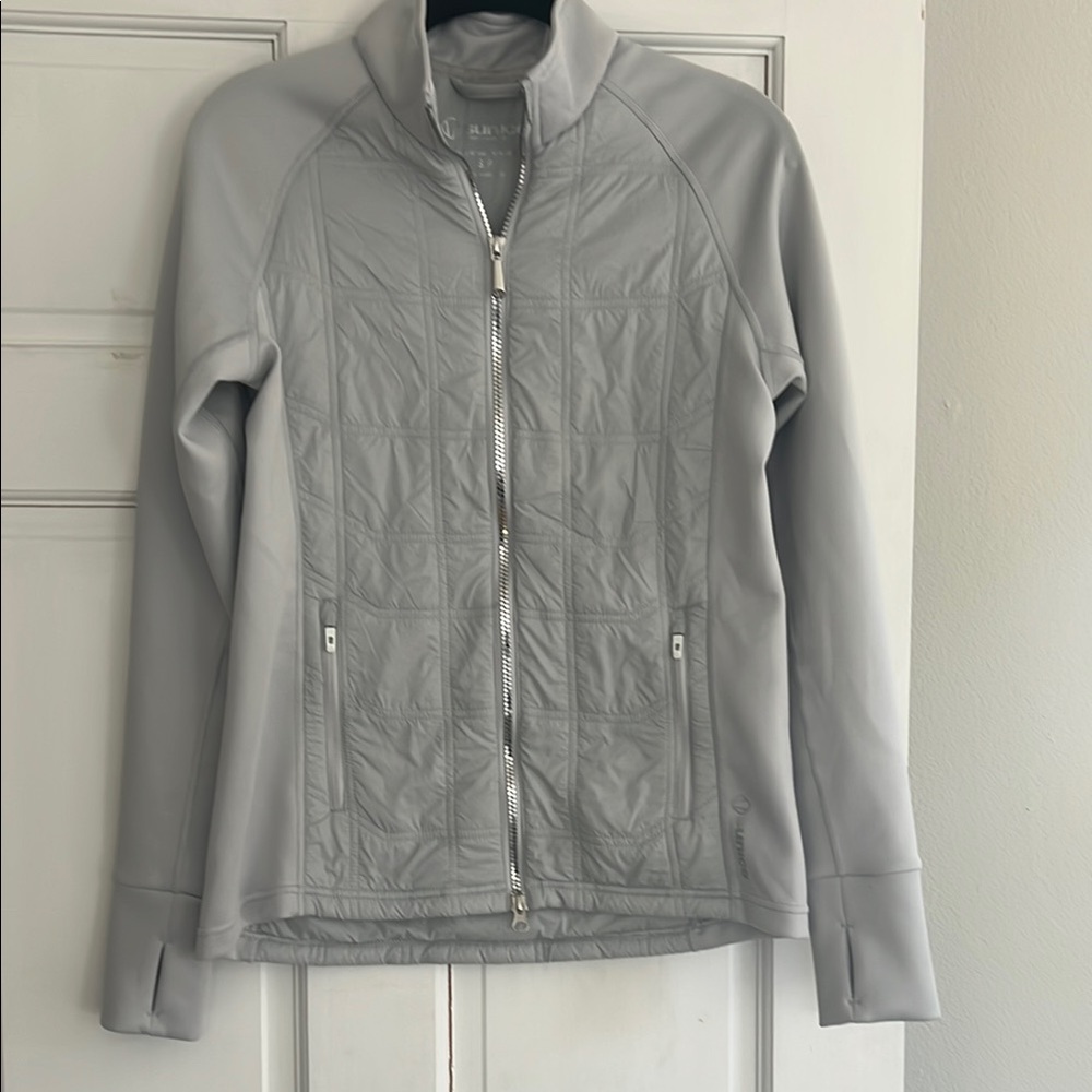 Gray Women's golf and tennis warmup jacket.